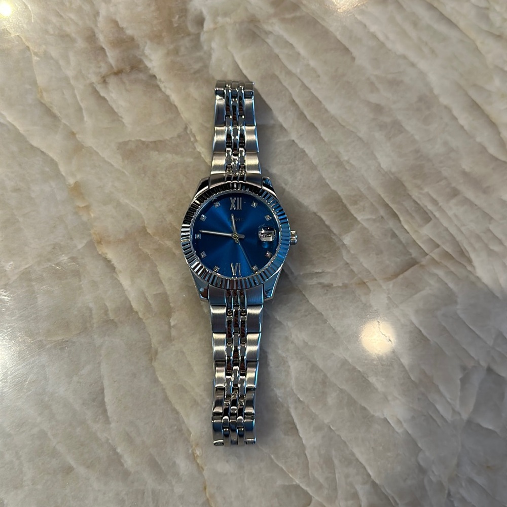 Silver fossil watch with blue face